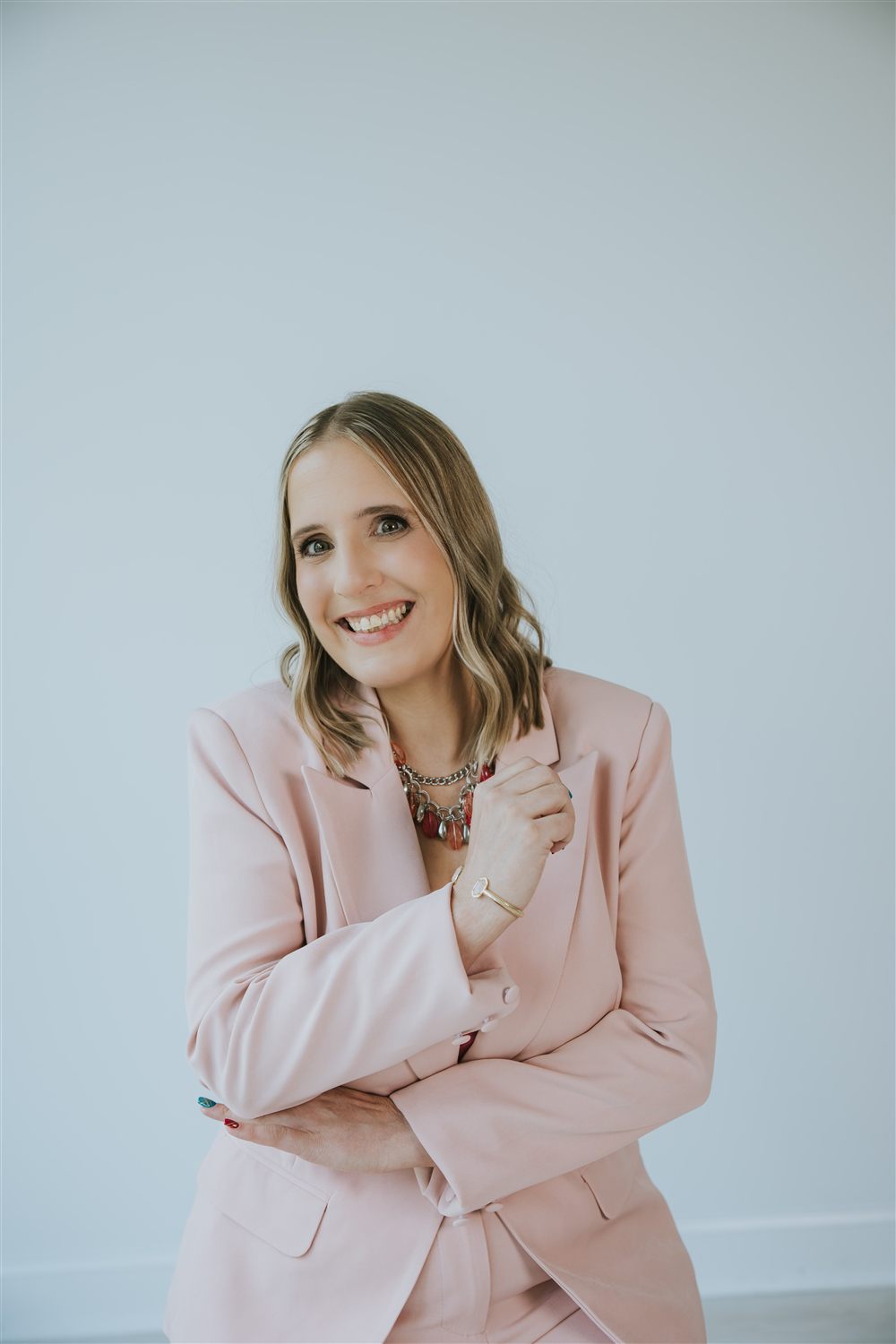 Maren Londahl-Smidt smiling warmly in a pink blazer